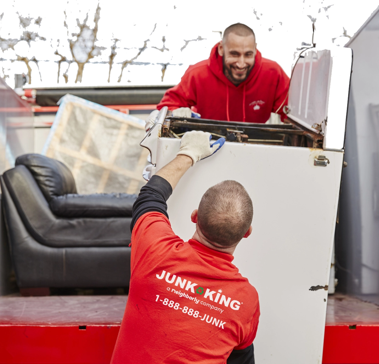 Junk King workers loading junk onto truck